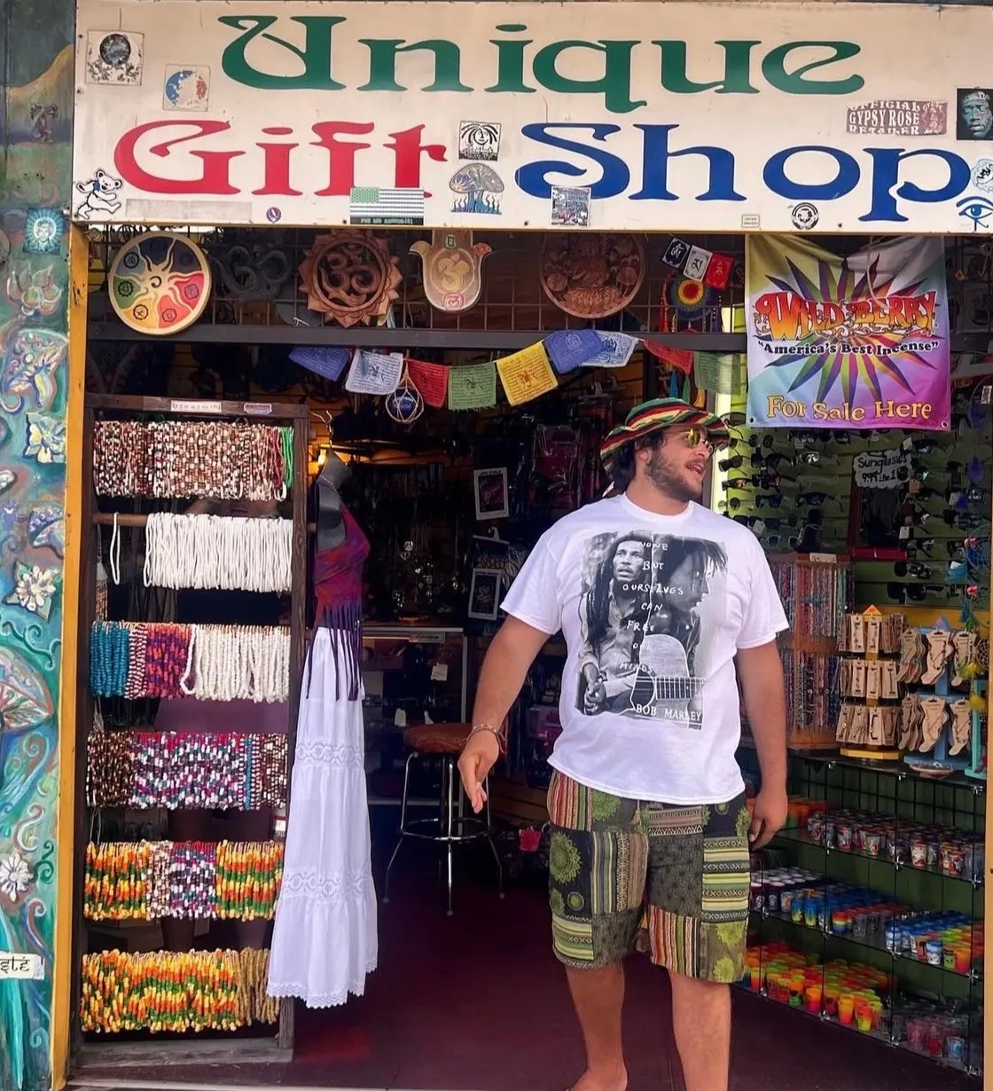 The open entrance of the colorful gift shop with merchandise displays on both sides.
